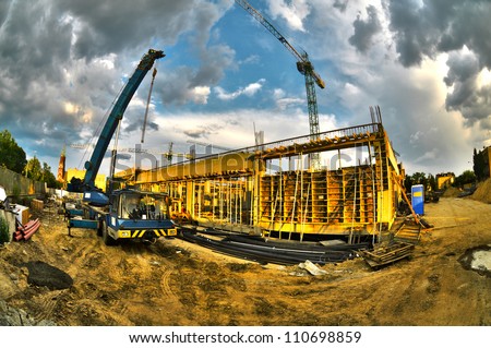 High dynamic range construction site with cranes Royalty-Free Stock Photo #110698859