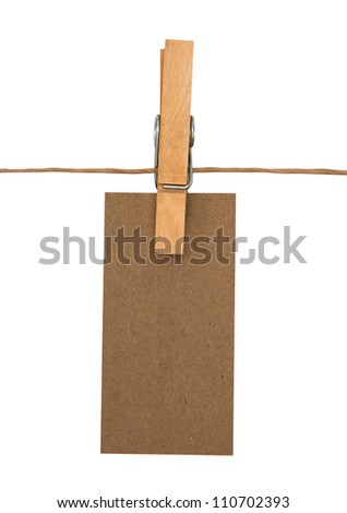 close up of a notes and a clothes pegs on white background