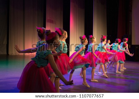 Girls are dancing on stage. Royalty-Free Stock Photo #1107077657