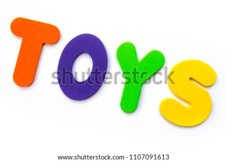 The word TOYS spelt out with coloured letters. 