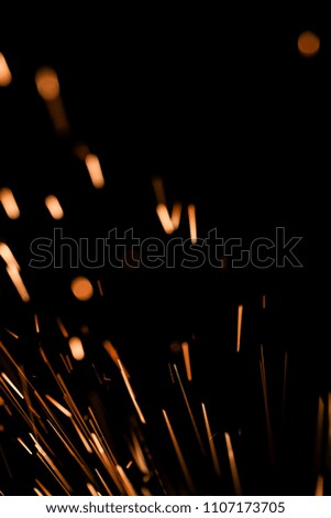 Close-up of sparks against black bakground.