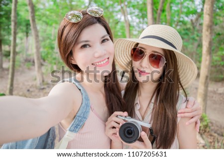 two beauty woman selfie happily in the forest