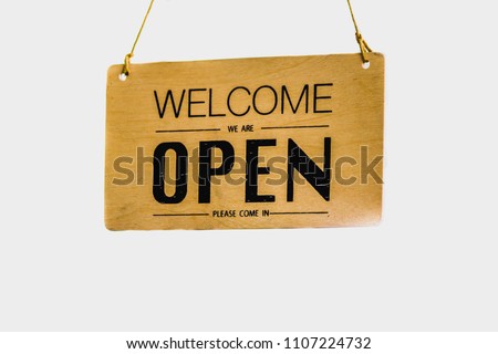 Signs made from wood. Write open the hanging rope at the front door Restaurant To allow customers to know today to open on white background , soft focus , blurred.