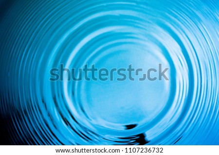 Top view Closeup blue water rings, Circle reflections in pool. Royalty-Free Stock Photo #1107236732
