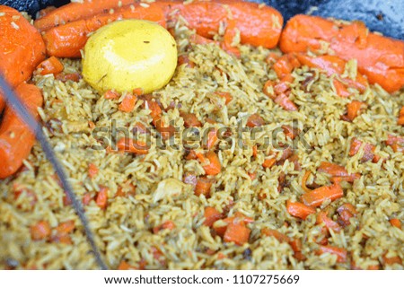 Fried rice with salsa. Eastern food. Summer holidays and food in nature. Stock Photo