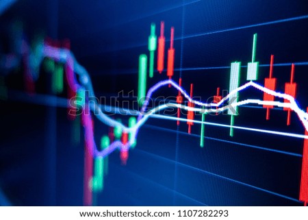 Stock market graph and candlestick chart for financial investment concept.
