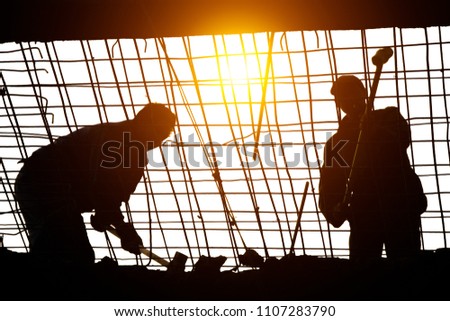 Engineers and construction teams demolished steel bars and concrete on high-rise buildings. A sunset background with a dim background in a light background