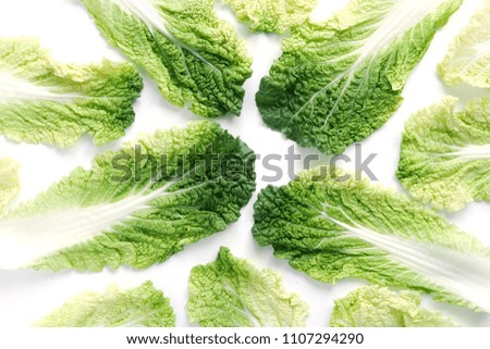 Composition of the leaves of Peking cabbage, creative flat layout, top view. The concept of healthy food.
