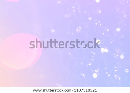 Purple glitter lights background. Defocused Bokeh vintage twinkling lights.  Festive background with natural boke and bright golden stars