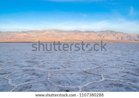 Death Valley: Badwater Salt Flats and Mountains at Dawn - Death Valley National Park, California, USA 
