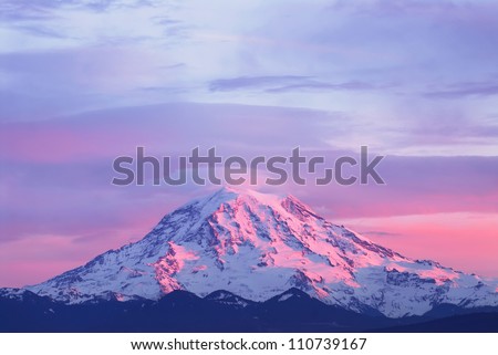Pink sunset light on Mount Rainier in the Cascade Range, Washington State, USA Royalty-Free Stock Photo #110739167
