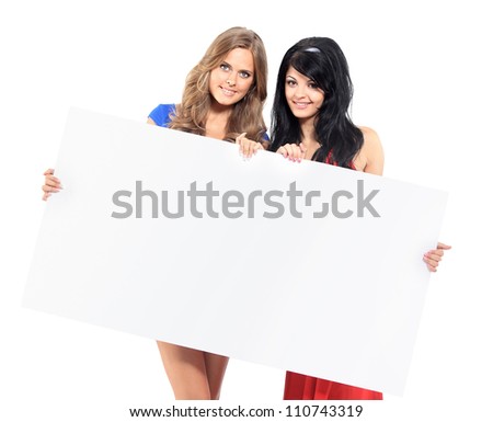 Two women with big white empty banner