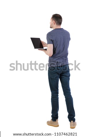 Back view of a man who is standing with a laptop. Rear view people collection.  backside view of person.  Isolated over white background. Student with laptop shows presentation