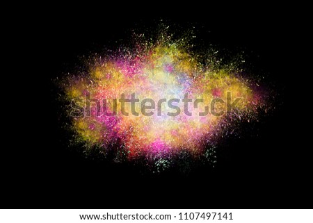 Multicolor powder explosion on black background.Paint Holi.Colored cloud. Colorful dust explode.