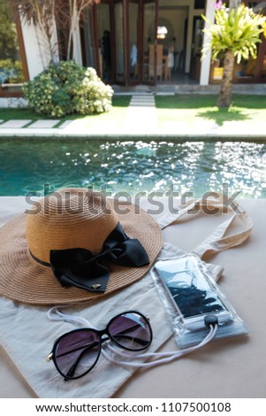 hat tote bag phone and sun glasses for swim tool
