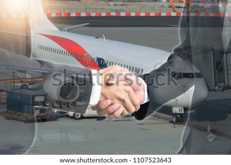 Double exposure of business people handshake with airplane