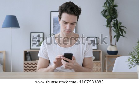 Man Using Smartphone, Browsing online Internet