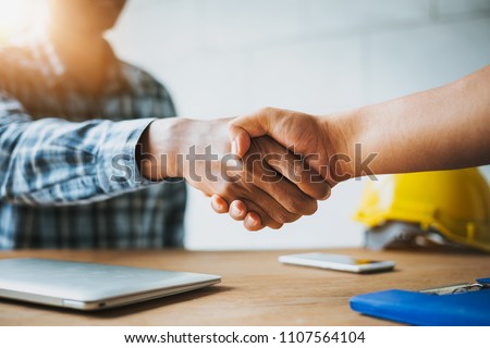 Negotiating business,Image of businessmen Handshaking,happy with work,Handshake Gesturing People Connection Deal Concept. Royalty-Free Stock Photo #1107564104