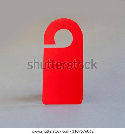 Red door hanger on a gray background