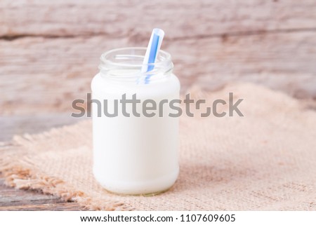 milk in a jar with a straw