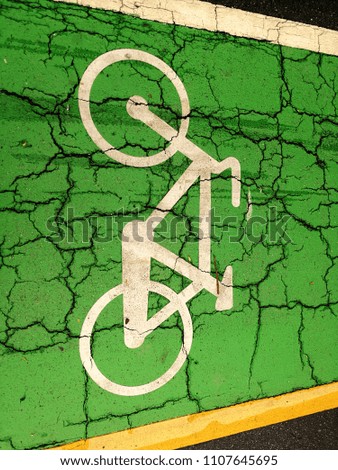 Sign and symbols of Bicycle lane on green street in the park for sport and exercise activity 