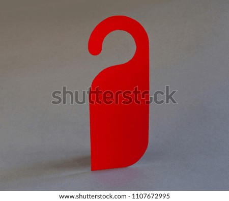 Red door hanger on a gray background