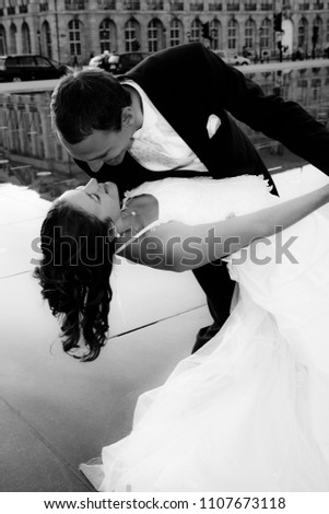 black and white picture beautiful wedding couple in marriage at bordeaux France in miroir d eau place