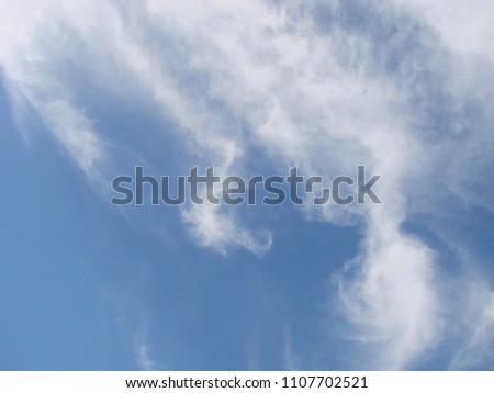 clear blue sky with plain white cloud with space for text background.