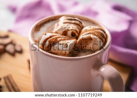 Cup of tasty cocoa drink with marshmallow, closeup