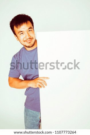 pretty cool asian man holding empty white plate smiling