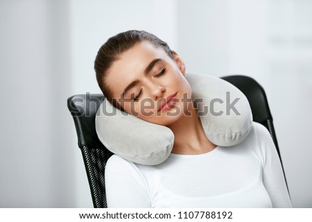 Travel Pillow. Woman With Pillow On Neck. Royalty-Free Stock Photo #1107788192