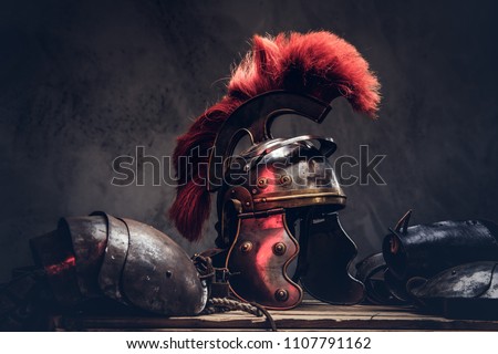 Complete combat equipment of the ancient Greek warrior lie on a box of wooden boards. Royalty-Free Stock Photo #1107791162
