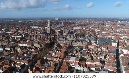 Aerial picture Bruges in Dutch Brugge is the capital and largest city of the province of West Flanders in the Flemish Region of Belgium famous for its canals and chocolate also showing Belfry tower