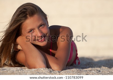 Portrait of gorgeous young girl  smiling while looking at you
