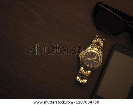 Man accessories in business style with gadgets, sunglasses, watch, cards and other luxury attributes on wooden background. Casual, office or fashion style. Blank place, mockup for text message