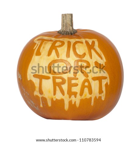 Picture of a pumpkin, with Trick Or Treat cut in the surface Isolated, white background
