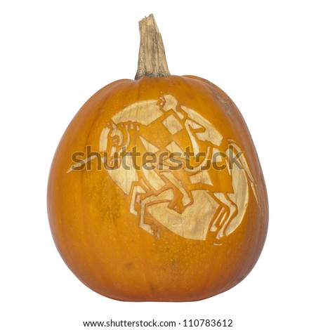 Picture of a pumpkin, with silhouette of a knight and horse cut in the surface Isolated, white background