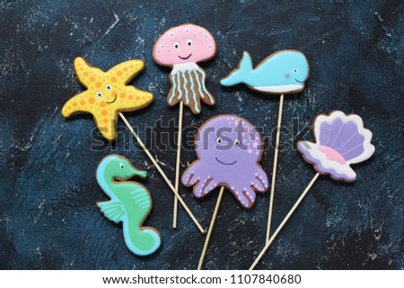 Homemade gingerbread cookies in the shape of octopus, shell, jellyfish, starfish, sea horse and whale