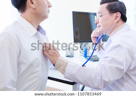 The doctor is diagnosing the patient.