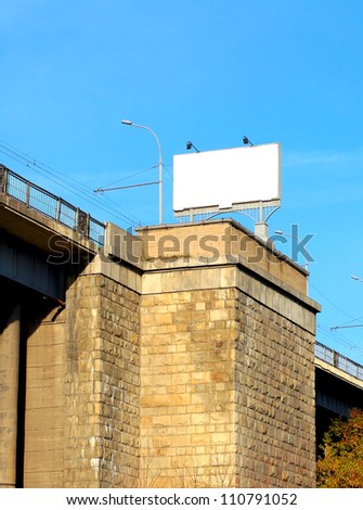 billboard on the stone building on the blue sky background