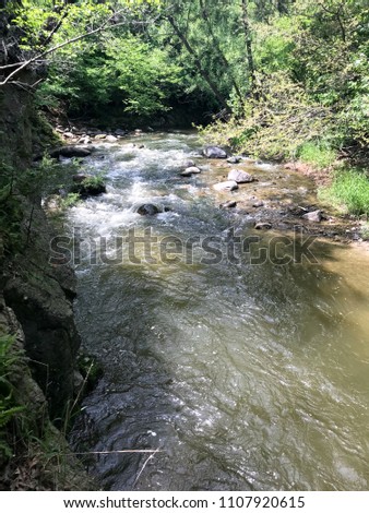Redwood Falls, Minnesota, USA - 5/27/2018:  River to waterfall