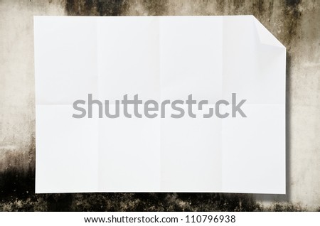 Blank white paper on the wall.