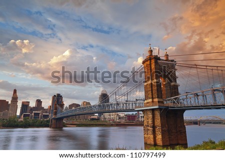 Cincinnati. Image of Cincinnati and John A. Roebling suspension bridge at sunset.