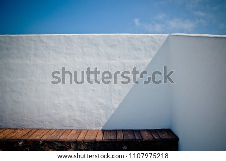 House with white Mediterranean walls with the sea in the background on the islands Royalty-Free Stock Photo #1107975218