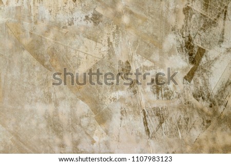 background, burnt plaster in an interesting divorce of sand and white