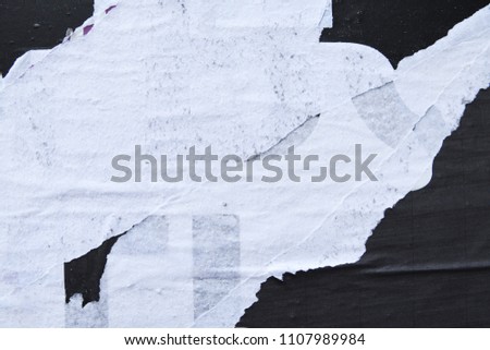 Poster street art collage, bits and pieces of ripped torn removed billboard placard paper, use for print or digital craft background texture Royalty-Free Stock Photo #1107989984