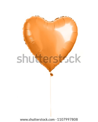 Orange heart balloon object for birthday party isolated on a white background