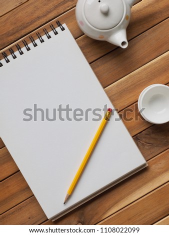 Sketch book, porcelain kettle, pencil
