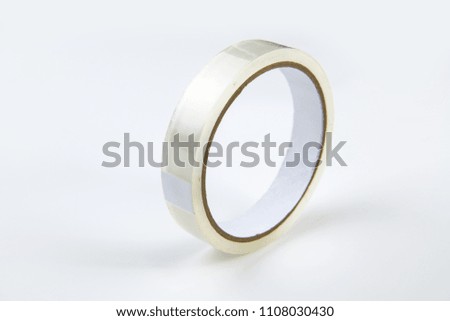 Roll of clear transparent sticky tape on white background including clipping path.