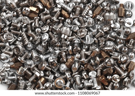 Background of many randomly scattered screws